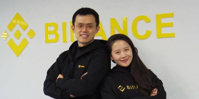 Changpeng Zhao i Yi He. W tle logo Binance. 