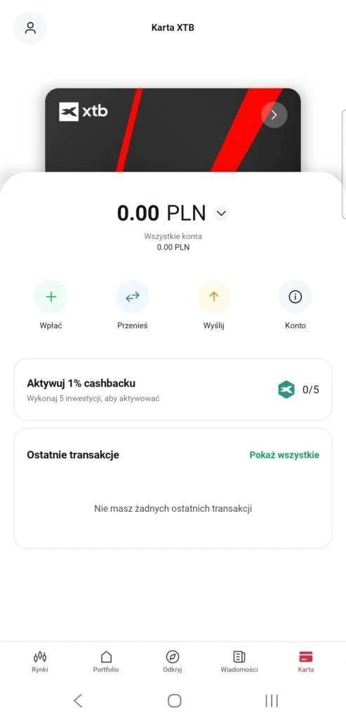 Ekran aplikacji mobilnej XTB z kartą płatniczą i saldem 0,00 PLN